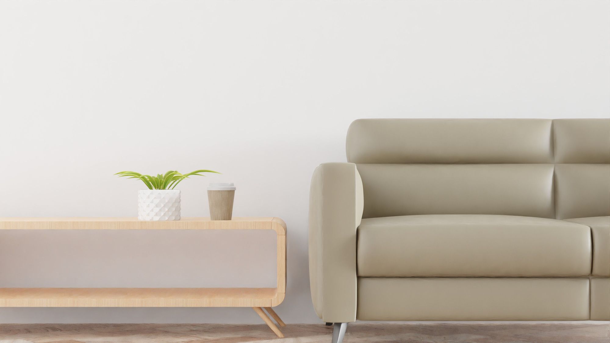 Beige leatherette sofa in a minimal room