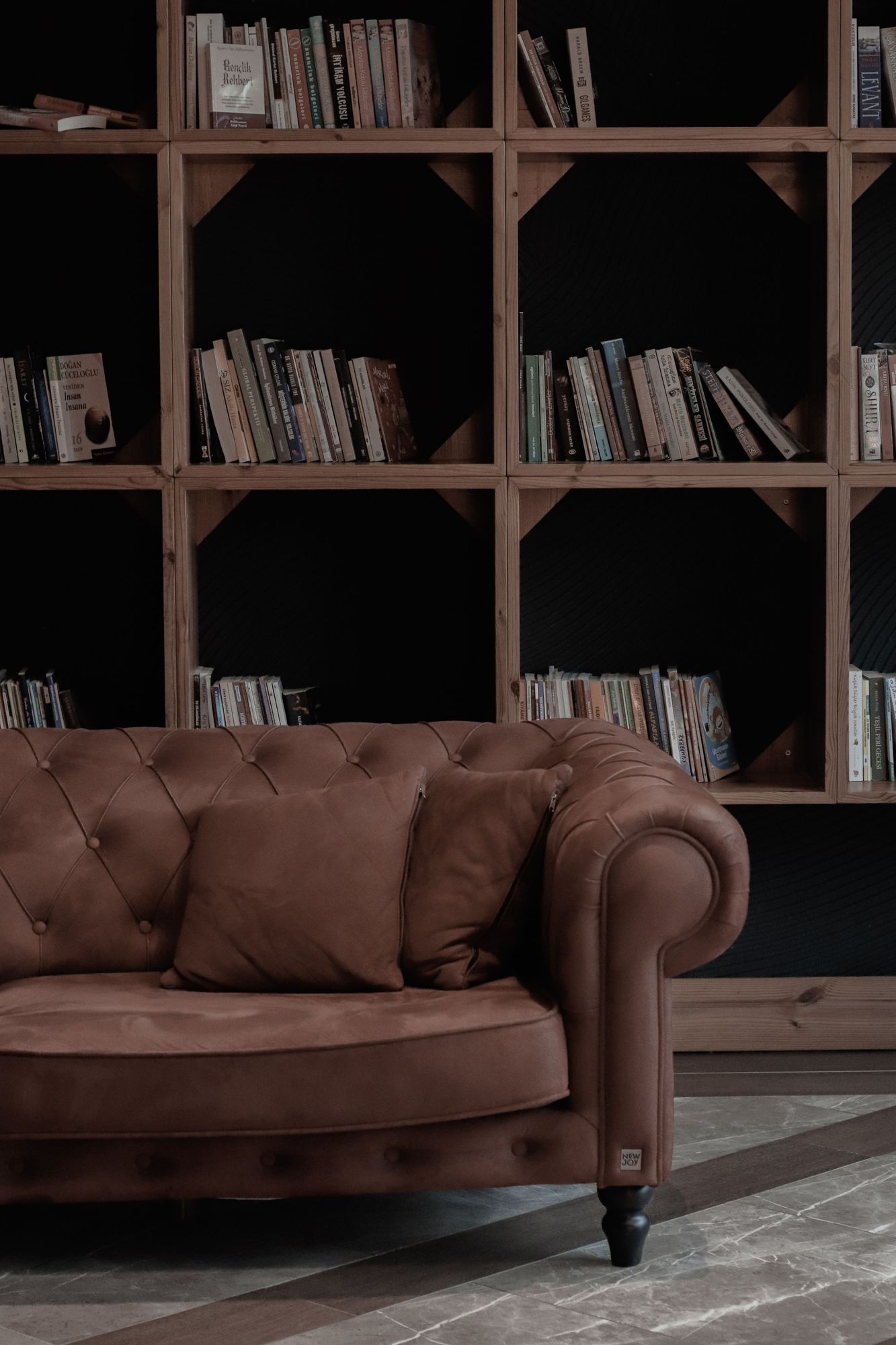 Brown chesterfield sofa in suede fabric