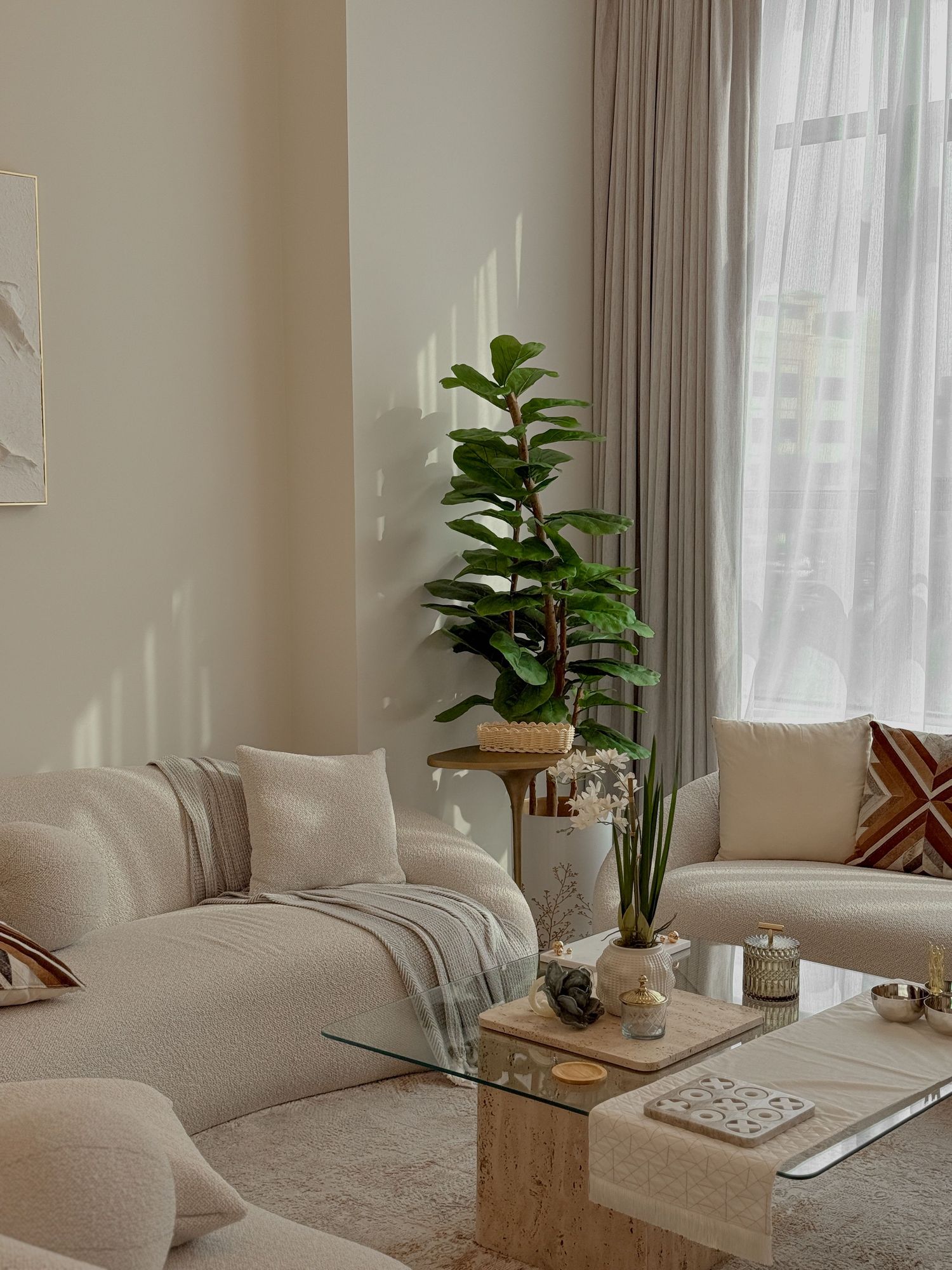 Ivory bouclé sofa in a bright living room