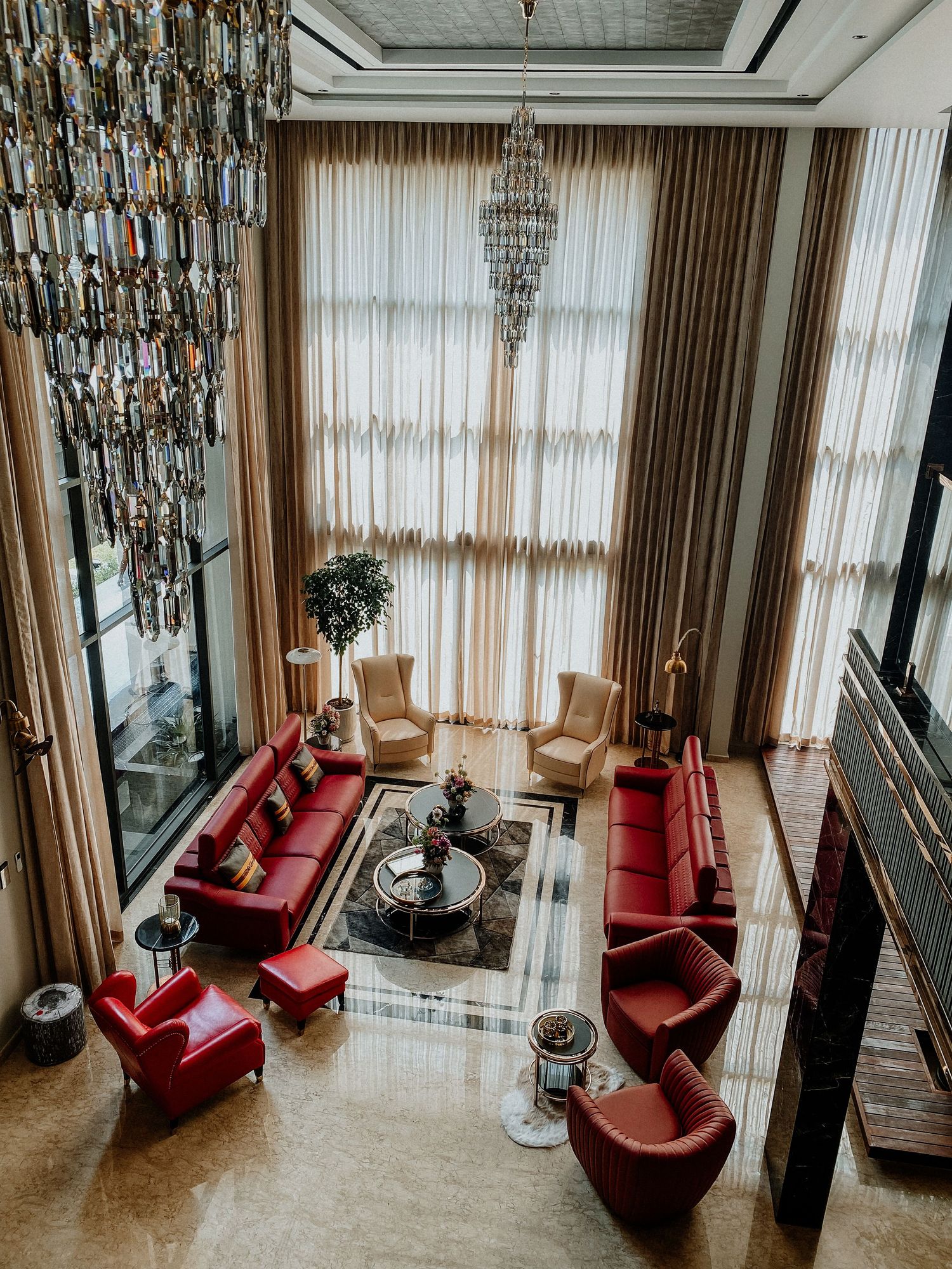 Red leatherette sofas in a luxury living room